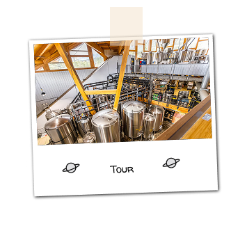 A picture looking over brewing machines from a beer brewery.