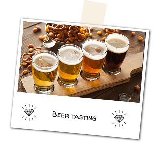 4 glassses with different styles of beers. Ranging from a light lager to a dark stout